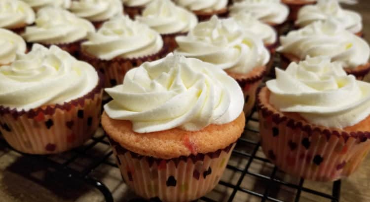 mardi gras cupcake with orange buttercream