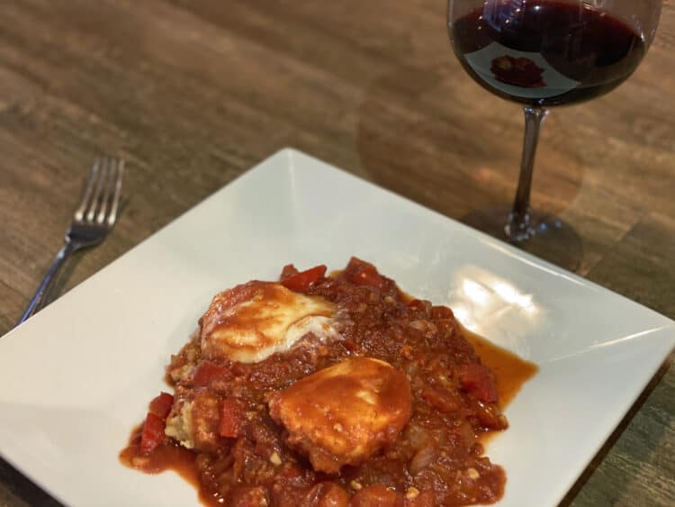 traditional shakshuka recipe on a polenta base