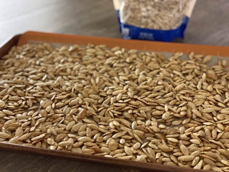 pumpkin seeds on cookie sheet