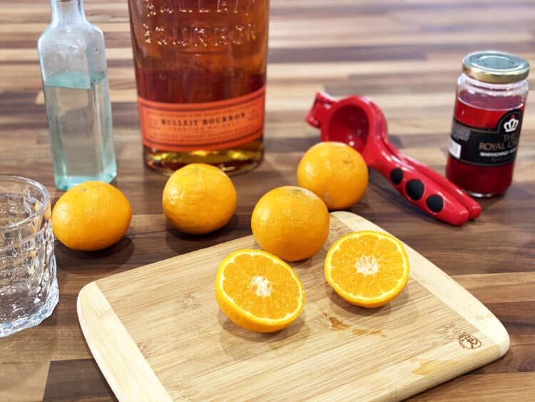 making a bourbon sour with tangerines