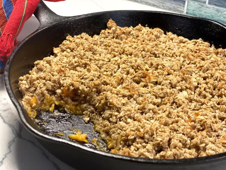 coconut apricot crumble in a cast iron pan