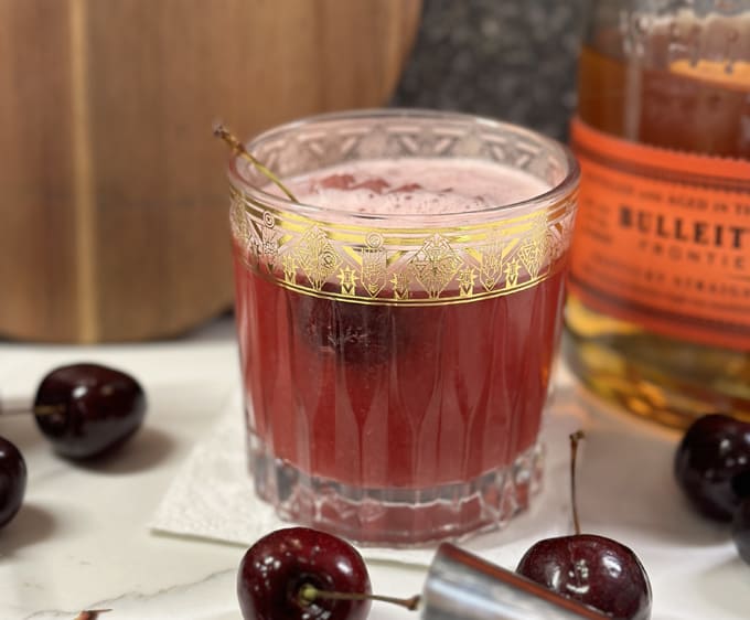 cherry bourbon sour cocktail recipe made with Bulleit Bourbon and Tasmina cherries