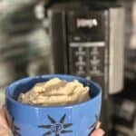 Melissa's Produce Hatch Pepper Kettle Corn-infused protein ice cream in a blue bowl in front of a Ninja Creami machine