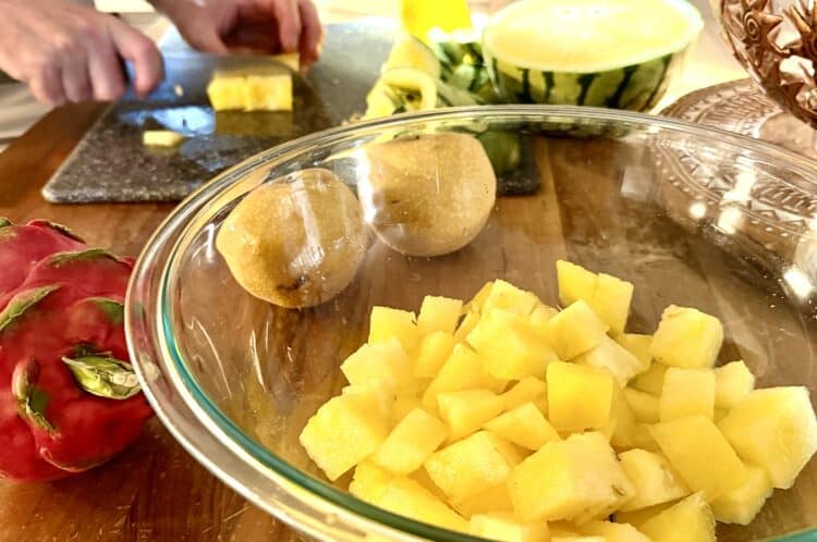 Citrus watermelon and asian pear salad fixings, with the golden watermelon chopped in the bowl
