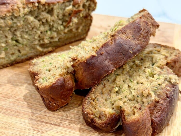 high-protein zucchini bread slices on a cutting board